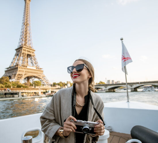 Woman enjoying landscape view on Paris city from the boat