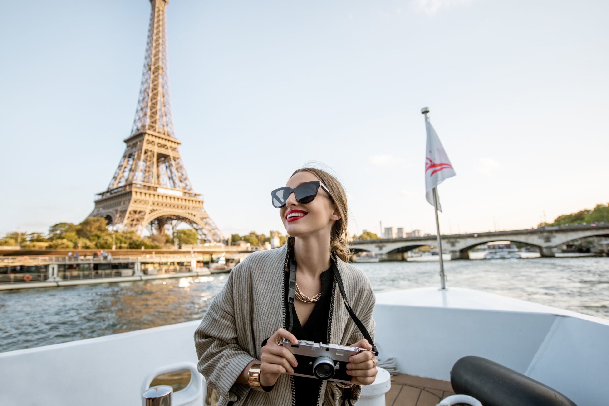 Woman enjoying landscape view on Paris city from the boat