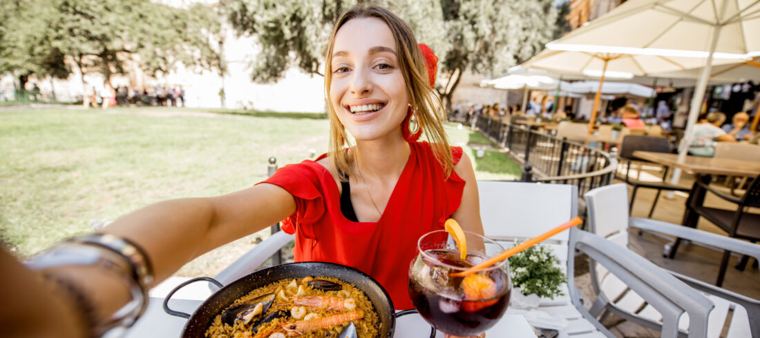 Woman with paella dish in Valencia
