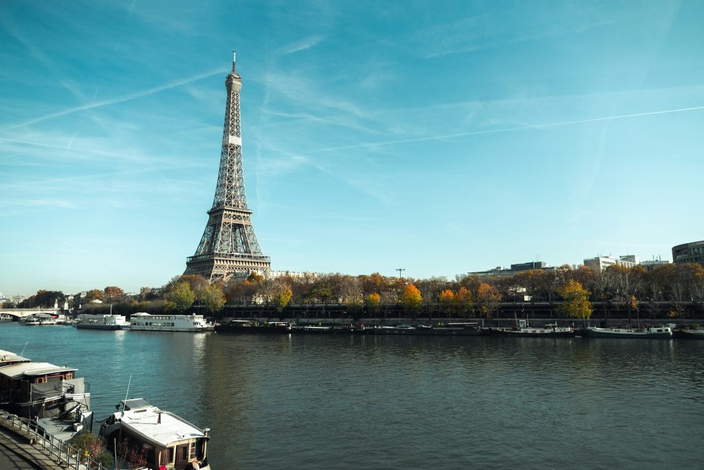 France Tours From USA / The Eiffel Tower standing over the Sienne River